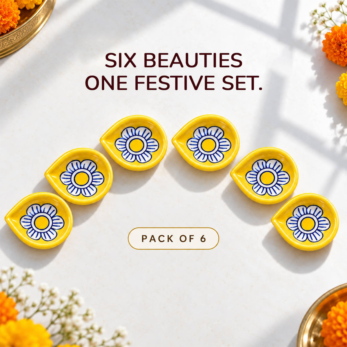 Glazed ceramic pooja diyas with traditional festive designs