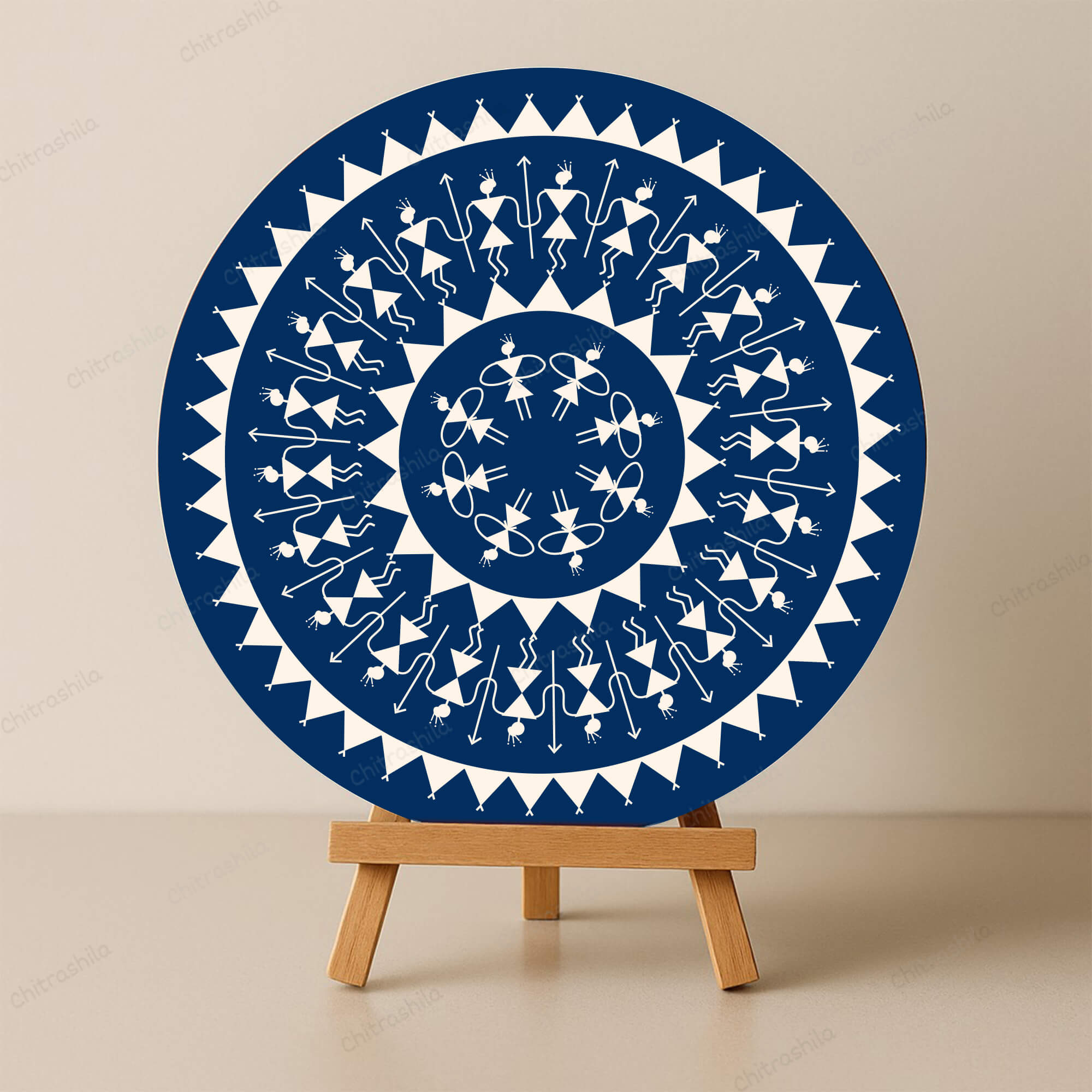 Decorative wooden board with a blue and white geometric Warli design on a beige background