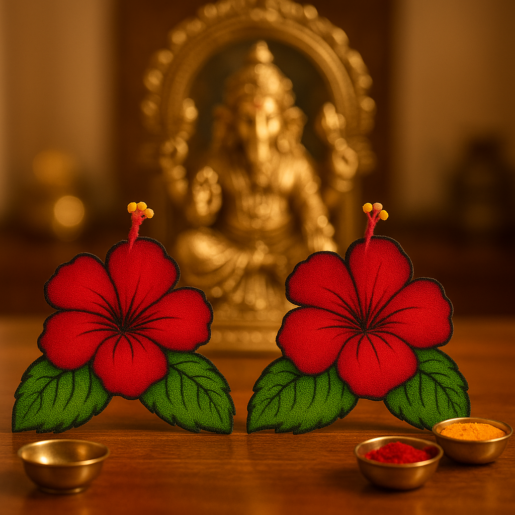 hibiscus flowers with green leaves on a wooden surface 