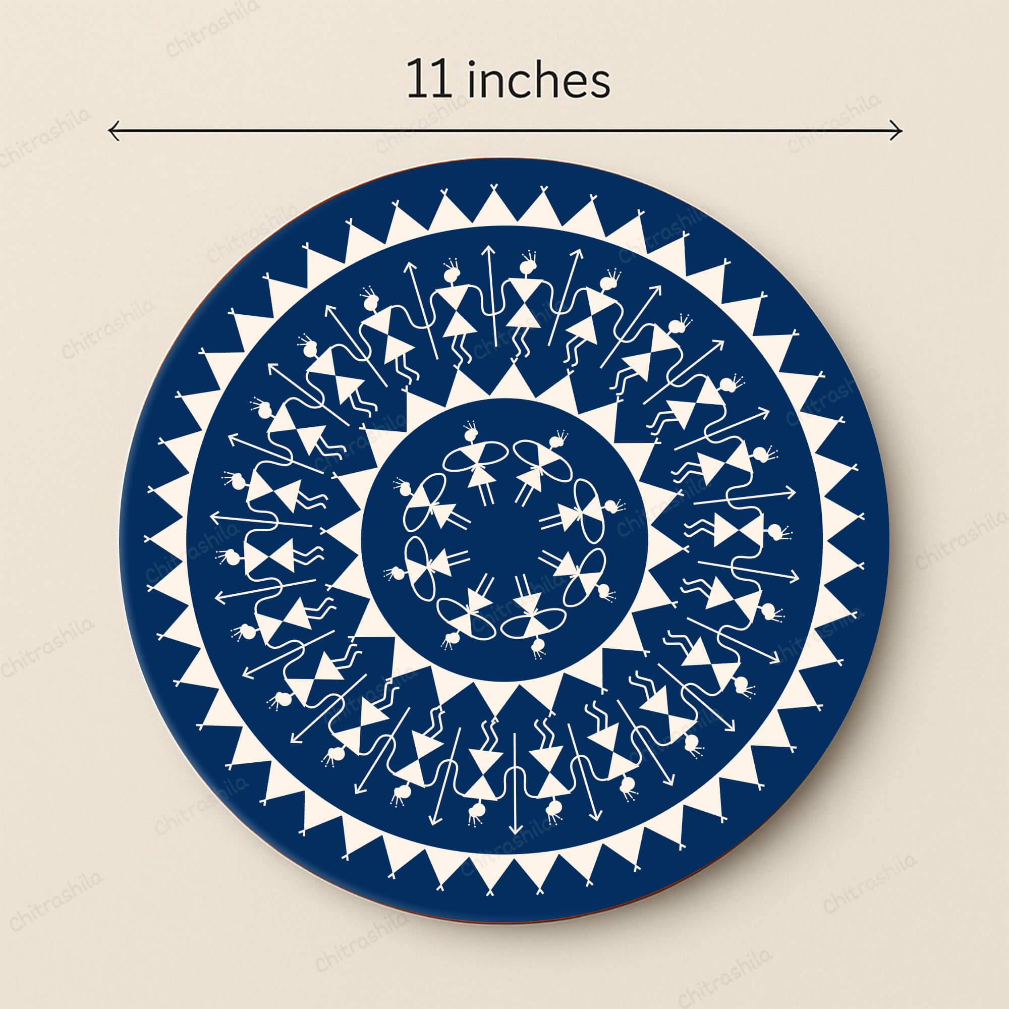 Decorative circular plate with blue and white Warli pattern, size indicated as 11 inches.