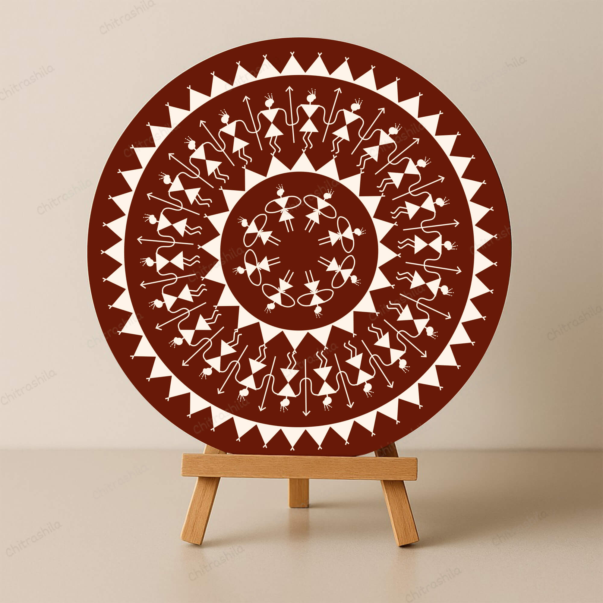 Decorative circular plate with Warli patterns on a stand against a beige background